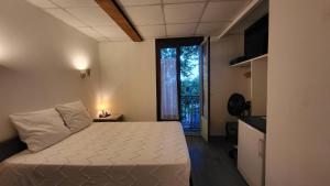 Ένα ή περισσότερα κρεβάτια σε δωμάτιο στο Residence Adele - Chambres d'Hôtes
