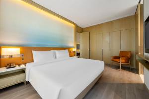 Postel nebo postele na pokoji v ubytování Steigenberger Hongqiao Shanghai