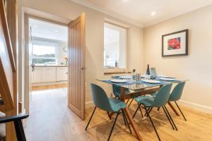 a dining room with a table and chairs at Dolfor in Menai Bridge