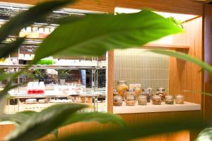 a display case in a kitchen with jars of food at InterContinental Residences Nha Trang by IHG in Nha Trang +112 photos