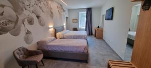 Katil atau katil-katil dalam bilik di B&B Villa Dina +78 gambar