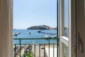 a view of the water from a room with a window at Pensione Silvia Santa Marì in Ponza