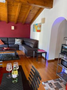 a living room with a couch and a table at Casa Mauro in Gravedona