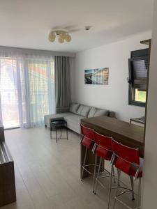 a living room with a couch and a table and chairs at REZEVICI BOUTIQUE VILLA in Petrovac na Moru