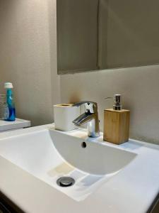 a bathroom sink with a faucet and a mirror at Residenza Corrado in Mantova