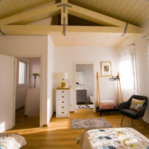 a bedroom with a bed and a cross on the ceiling at Casaluna in Udine