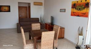 a living room with a table and a couch at Pandora Ocena View II in Sal Rei