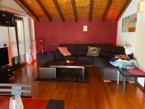 a living room with a couch and a table at Casa Mauro in Gravedona