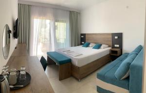 a bedroom with a bed and a couch at REZEVICI BOUTIQUE VILLA in Petrovac na Moru +37 photos