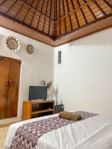 Voodi või voodid majutusasutuse Pillow Inn Ubud toas