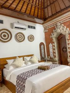 Voodi või voodid majutusasutuse Pillow Inn Ubud toas