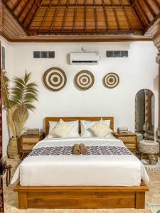 Voodi või voodid majutusasutuse Pillow Inn Ubud toas