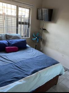Ένα ή περισσότερα κρεβάτια σε δωμάτιο στο Empangeni guest house 2