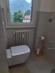 a bathroom with a toilet and a window at Apartment Centre nhe in Lecco +32 photos