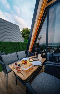 a table with food on it on a balcony at Ala World Resort in Kartepe