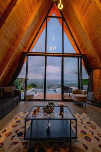 a living room with a large window in a house at Ala World Resort in Kartepe