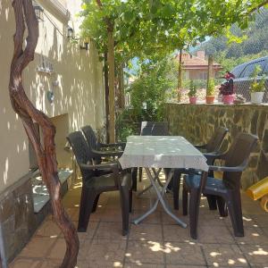a table and chairs sitting on a patio at Viktoria House in Sapareva Banya