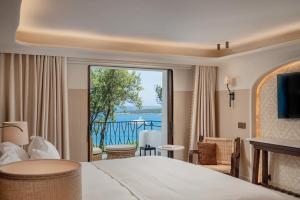 Postel nebo postele na pokoji v ubytování Hotel Pitrizza, Costa Smeralda