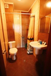 a bathroom with a toilet and a sink at Hotel Marant in Sozopol