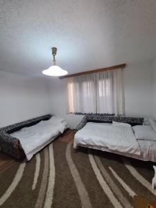 Postel nebo postele na pokoji v ubytování Buća Potok