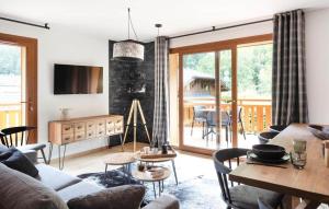 a living room with a couch and a table at Alpine Creek - Luxury Ski-in Avoriaz Morzine in Morzine