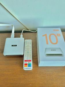 a remote control sitting next to a box with a box at Budget stay in Kajang town near to MRT in Kajang