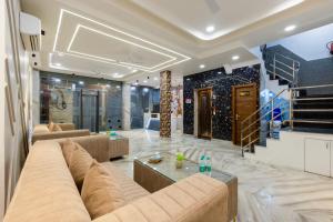 a living room with a couch and a table at Hotel U-N Star - Walk in from New Delhi Railway Station and Connaught Place in New Delhi