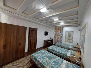 Кровать или кровати в номере Hotel Gulnaraxanum Boutique This hotel is nearby the center of the old city Every room decorated in the unique style