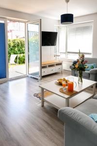 a living room with a couch and a table at Keba in Władysławowo