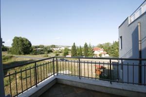 a balcony of a building with a fire hydrant at Hotel Marant in Sozopol