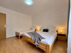 Postel nebo postele na pokoji v ubytování Apartment Dunato I