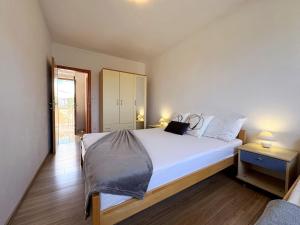 Postel nebo postele na pokoji v ubytování Apartment Dunato I
