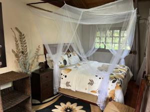 Moz Inn - Coconut View Resort 객실 침대