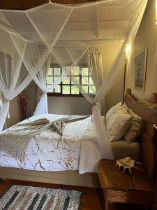 Moz Inn - Coconut View Resort 객실 침대