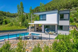 a villa with a swimming pool in the mountains at Begonvilla Göcek Gökceovacik in Fethiye +33 photos