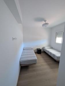 Ένα ή περισσότερα κρεβάτια σε δωμάτιο στο Apartamento Luxury la Ballena +14 φωτογραφίες