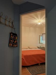 a bedroom with a bed and a ceiling at BEllA in Sinj