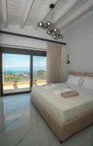 Ένα ή περισσότερα κρεβάτια σε δωμάτιο στο Sunrise Villas Collection +141 φωτογραφίες