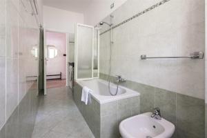 a bathroom with a sink and a toilet and a shower at IseoLakeRental - Casa Massimo in Lovere +13 photos