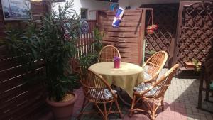 a table and chairs sitting on a patio at Motel Eden in Zamość