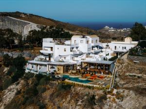 an aerial view of a white house on a cliff at Divino Caldera in Akrotiri