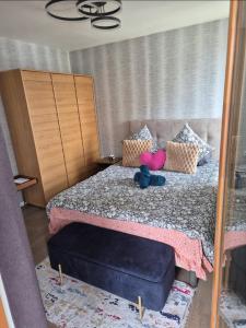 a bedroom with a bed with a large mirror at Chic Appartement Sacré Cœur of Paris with Parking in Paris