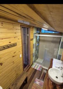 a bathroom with a sink and a shower at chalé Ateliê in Itatiaia