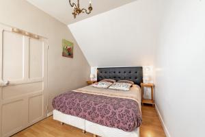 Postel nebo postele na pokoji v ubytování Grande Maison Familiale - vue mer