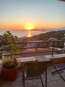 a view of the sunset from the balcony of a house at REZEVICI BOUTIQUE VILLA in Petrovac na Moru