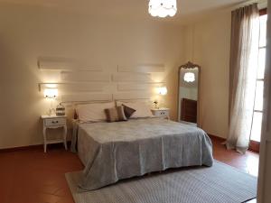 A bed or beds in a room at Il Borgo di San Gervasio