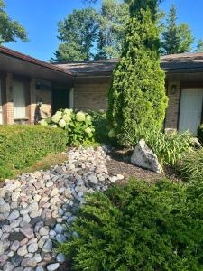 a house with a stone path in front of a yard at Rideau Heights Inn in Ottawa +15 photos
