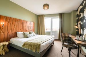 Postel nebo postele na pokoji v ubytování Baya Hotel