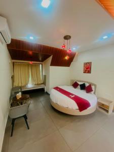 a bedroom with a large bed in a room at CASA SIGN PRIVATE POOL VILLa in Meppādi