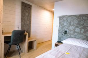 Postel nebo postele na pokoji v ubytování Hotel Aletsch